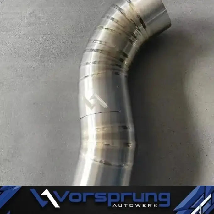 Titanium intake pipe for Audi S4 S5 Q5 SQ5 3.0T, curved with welded segments on grey surface