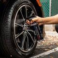 WASH & WHIPS Daytona Tire Coating & Shine bottle showing black tire with glossy finish on a car wheel