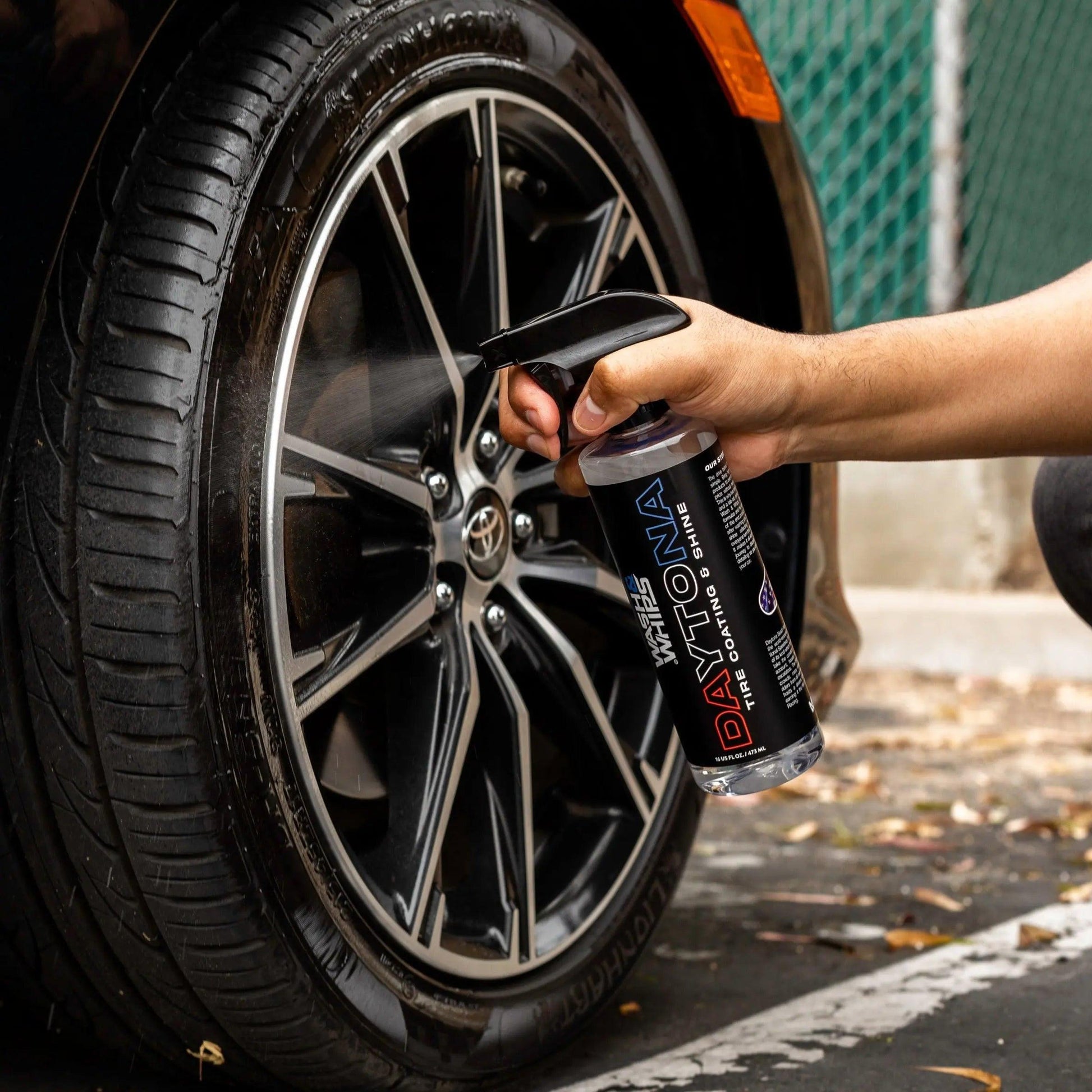 WASH & WHIPS Daytona Tire Coating & Shine bottle showing black tire with glossy finish on a car wheel