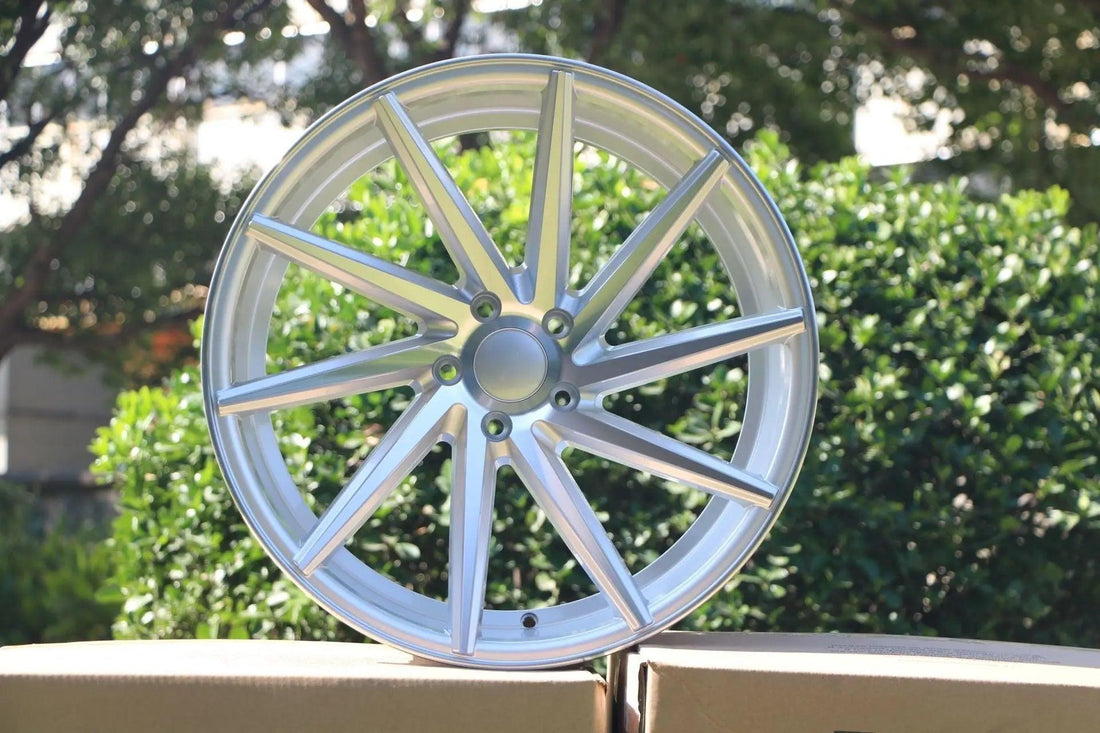 Silver 17-inch swirl style wheels by WheeloutletNJ with a machined face, 8-inch width, and 35mm offset.
