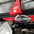ZSPEC billet battery hold down bracket installed on a Nissan Z32 300ZX, with stainless hardware securing the battery in place.