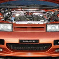 ZSPEC Design black front bumper plate for Nissan Z32 300ZX, powder-coated billet with Japanese Z32 logo, fits '90-99 models.
