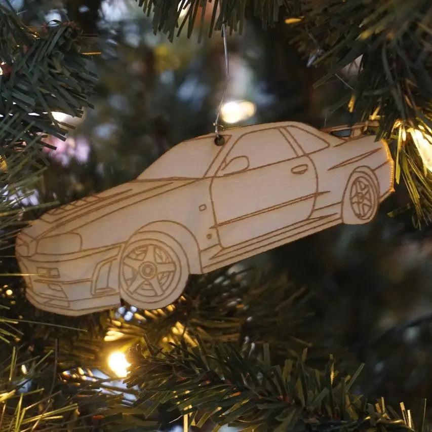 Laser-engraved ZSPEC Design Nissan GTR R34 birch ornament, approximately 5 inches wide, showcasing detailed automotive artwork.