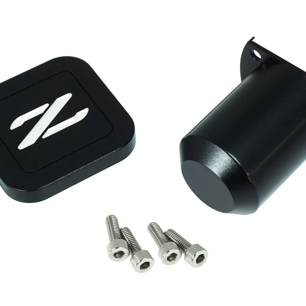Silver ZSPEC Design billet aluminum cruise control cap covers for 1990-1996 Nissan Z32 300ZX, with Z logo, on a car dashboard.
