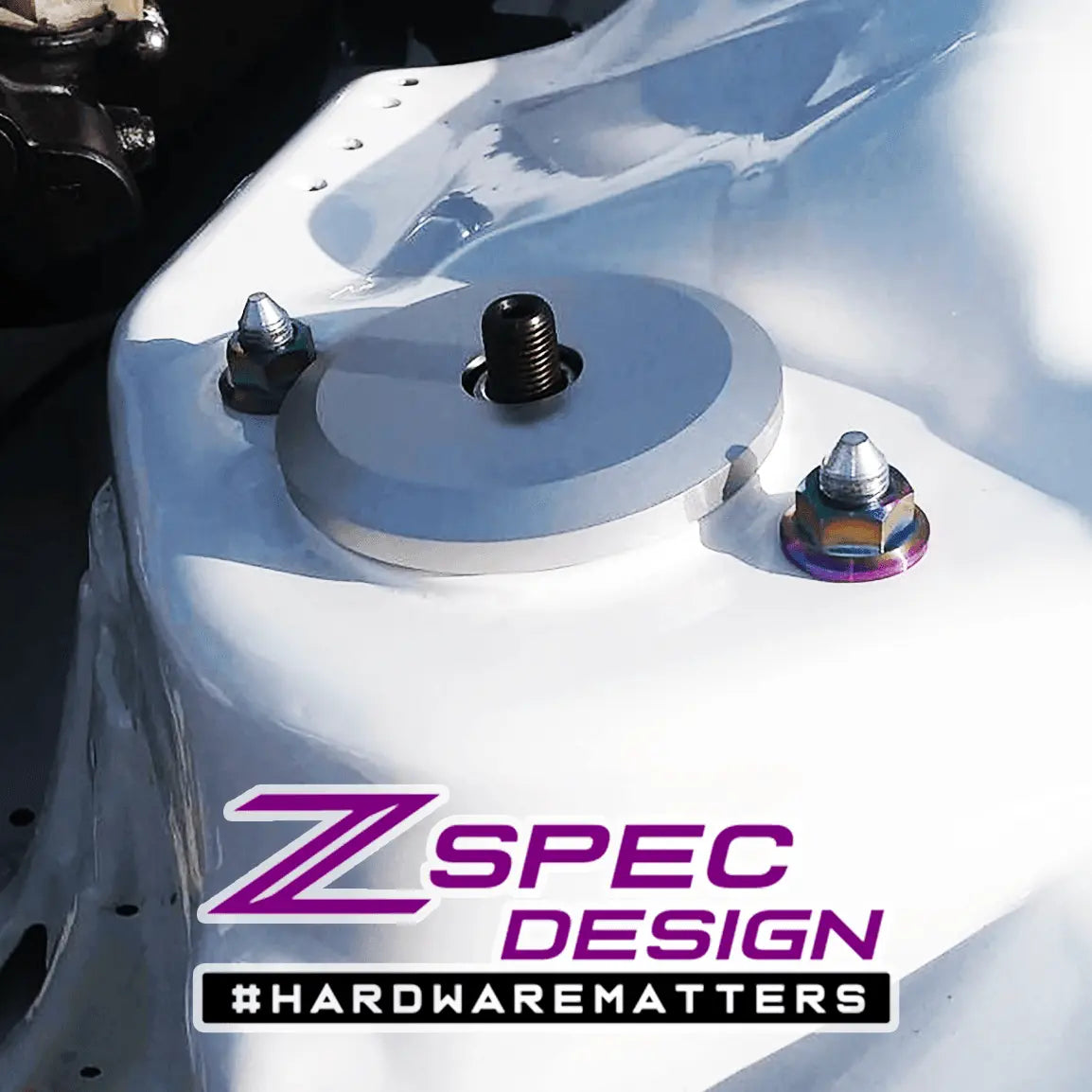 ZSPEC Design Grade-5 titanium shock tower flare nuts for Nissan Z32 300ZX, shown with a burned finish.